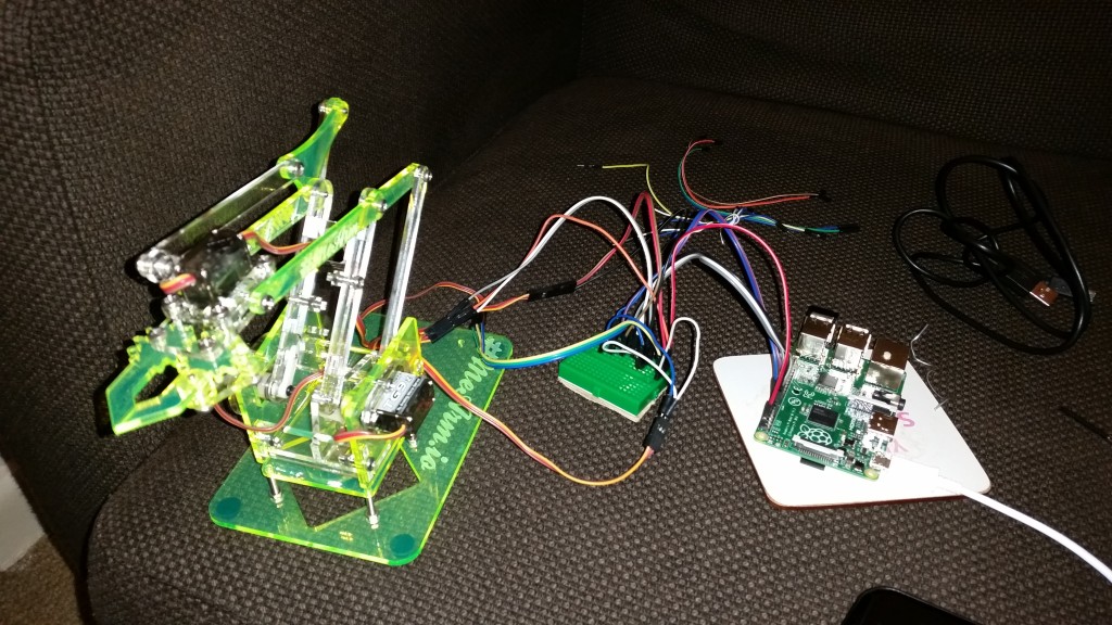 Me Arm servos wired directly to Pi GPIO (breadboard used for power distribution only)